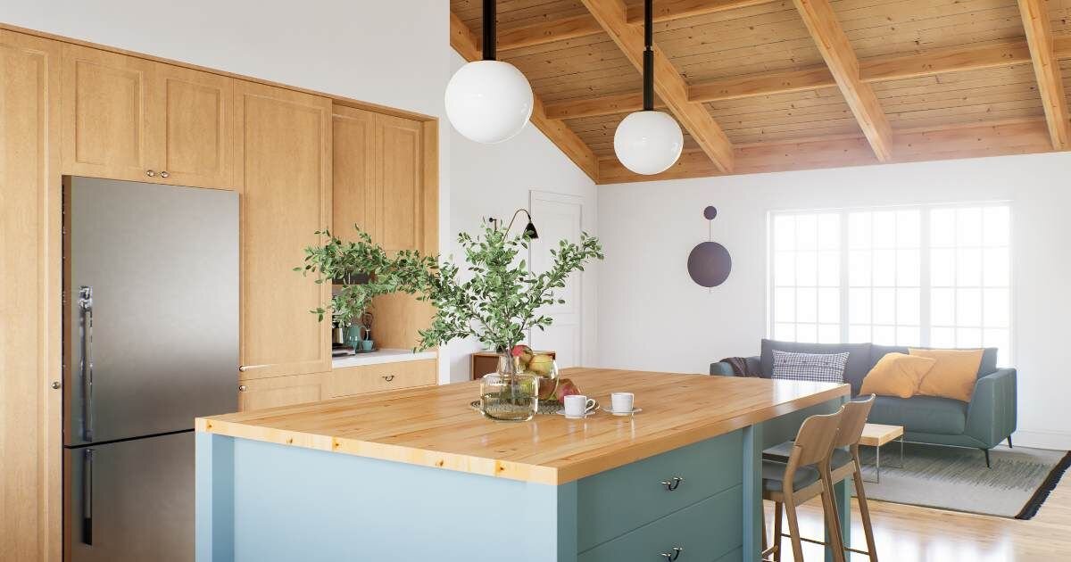 light wooden kitchen with a blue colored island 